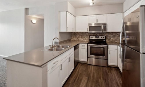 c-shaped kitchen with track lighting