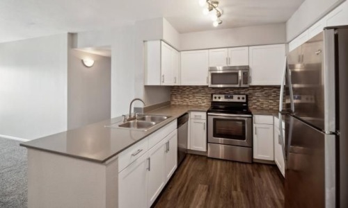 c-shaped kitchen with track lighting
