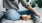 woman sits on a rug with a bowl of popcorn