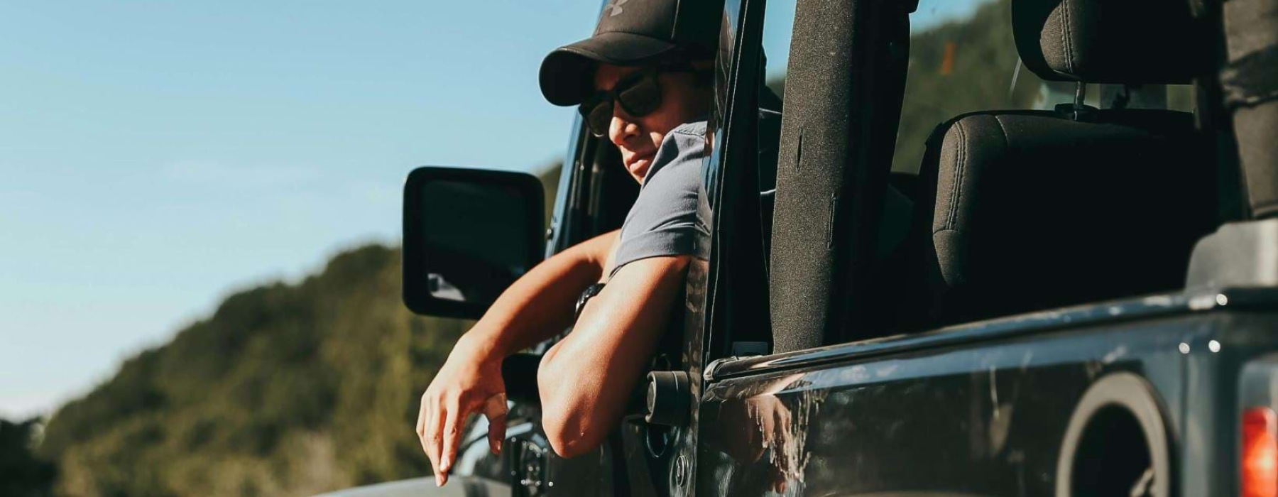 a person driving a jeep